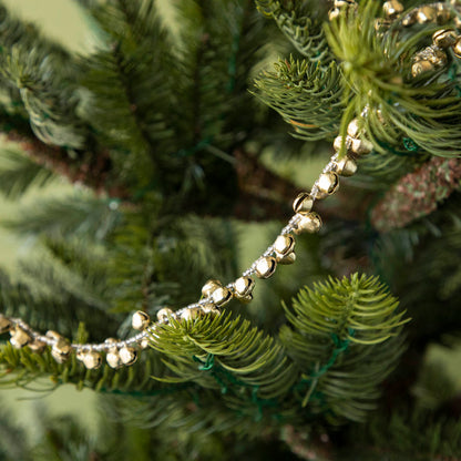 Bell Garland draped on a tree.