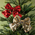 Red sequin bow ornament and gold sequin bow ornament in tree