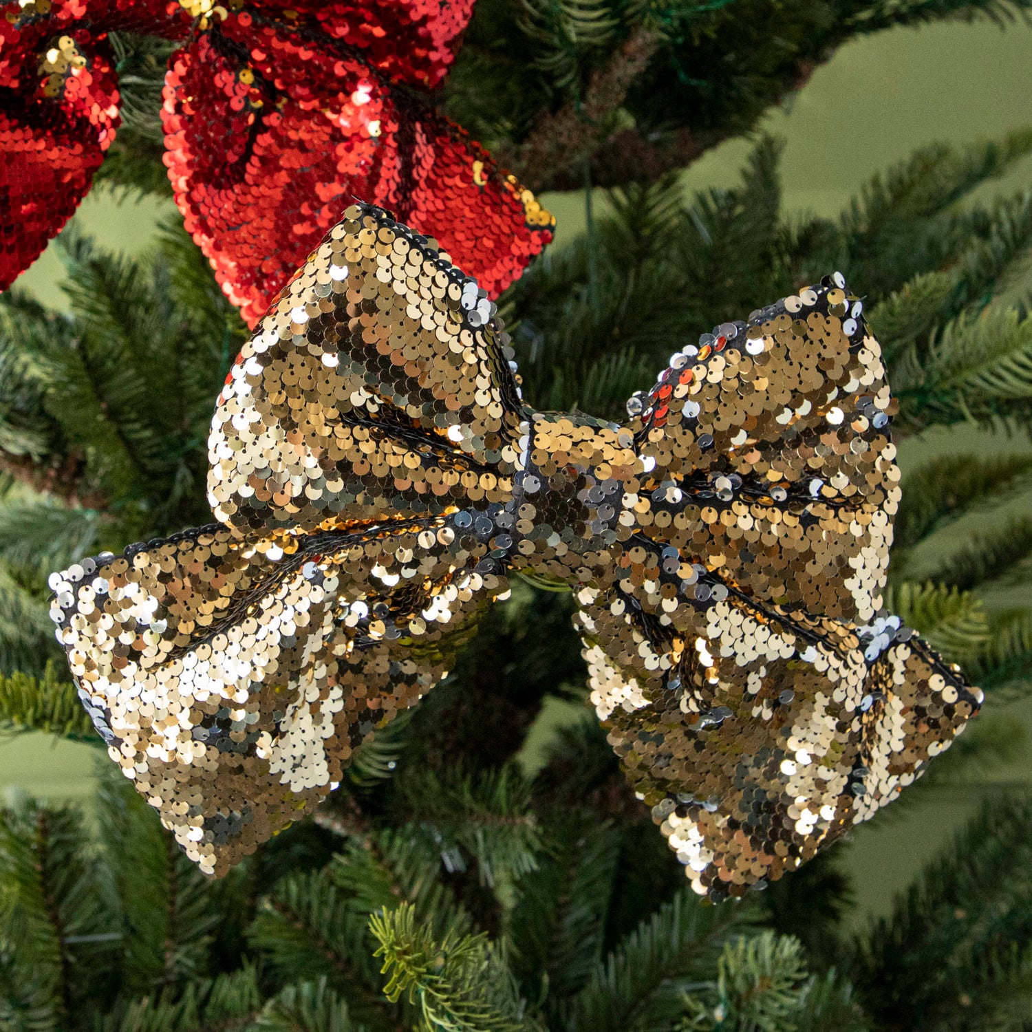 close up of gold sequin bow in tree