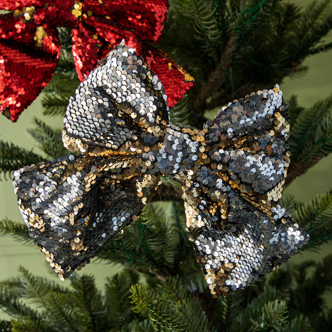 close up of gold sequin bow in tree