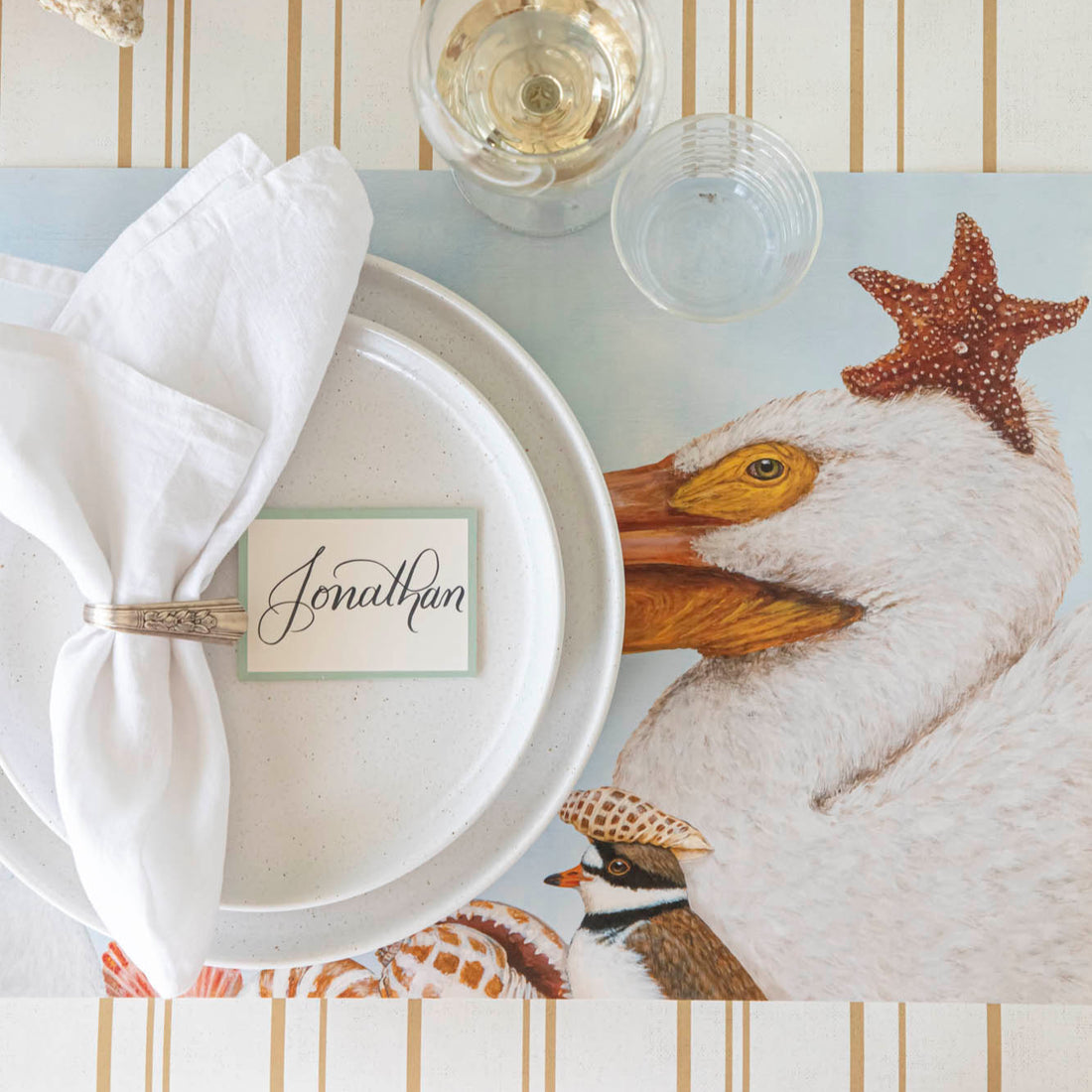 Shorebirds Placemat under a place setting on the Antique Gold Stripe Runner.