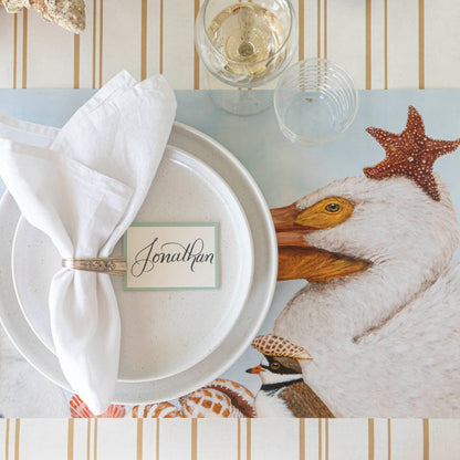 Shorebirds Placemat under a place setting on the Antique Gold Stripe Runner.