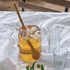 A pitcher of iced tea with a Bambu Wholesale bamboo tasting spoon.