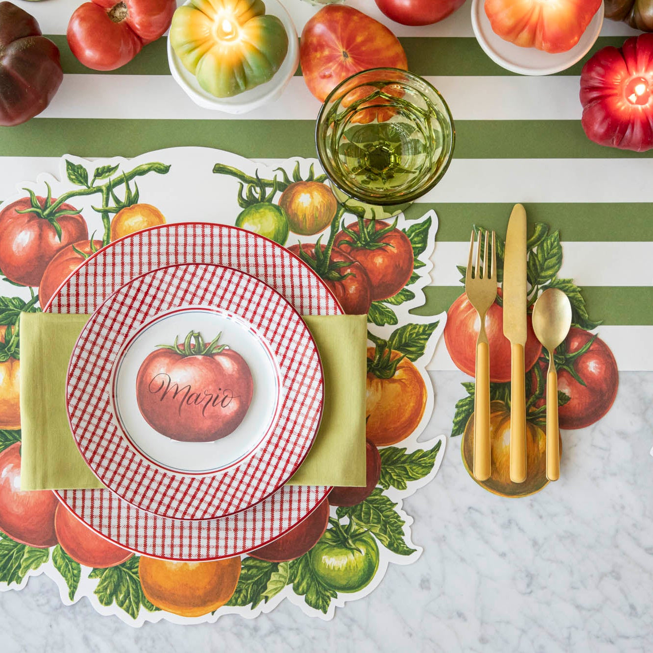 Tomato Table Accent under flatware next to a summery, tomato place setting.