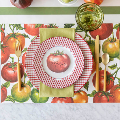 A summery, tomato themed table setting, with the Tomato Vine Placemat on the Moss Classic Stripe Runner.