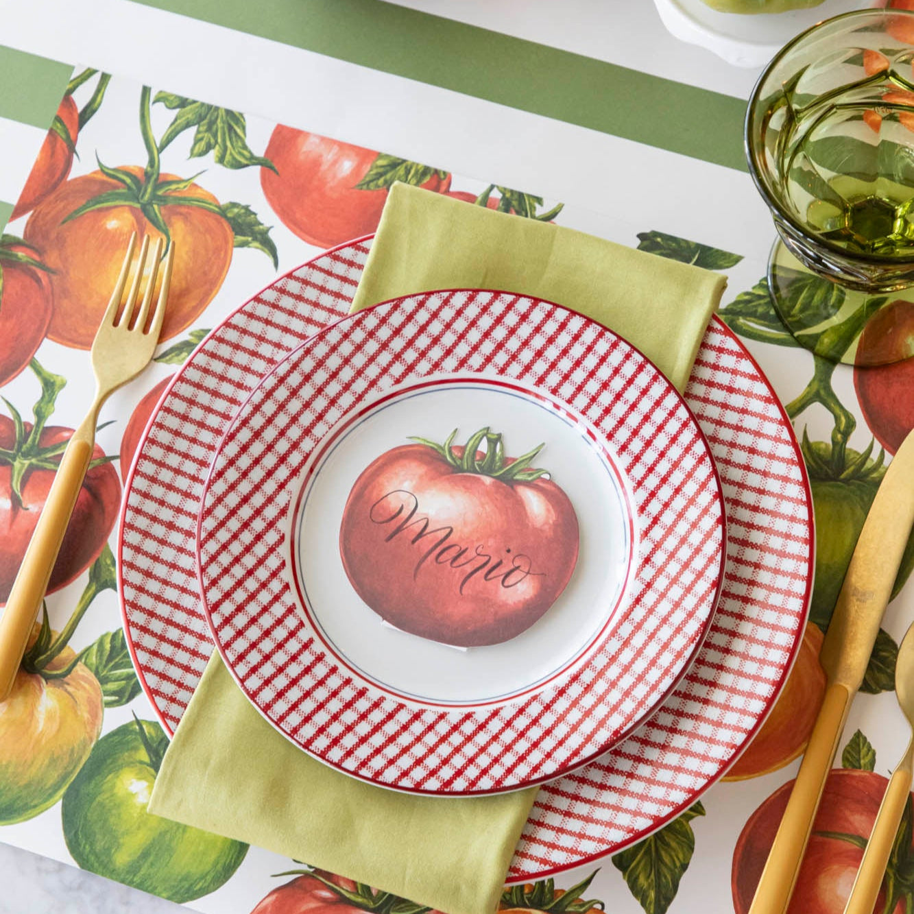 A summery, tomato themed table setting, with the Tomato Vine Placemat on the Moss Classic Stripe Runner.