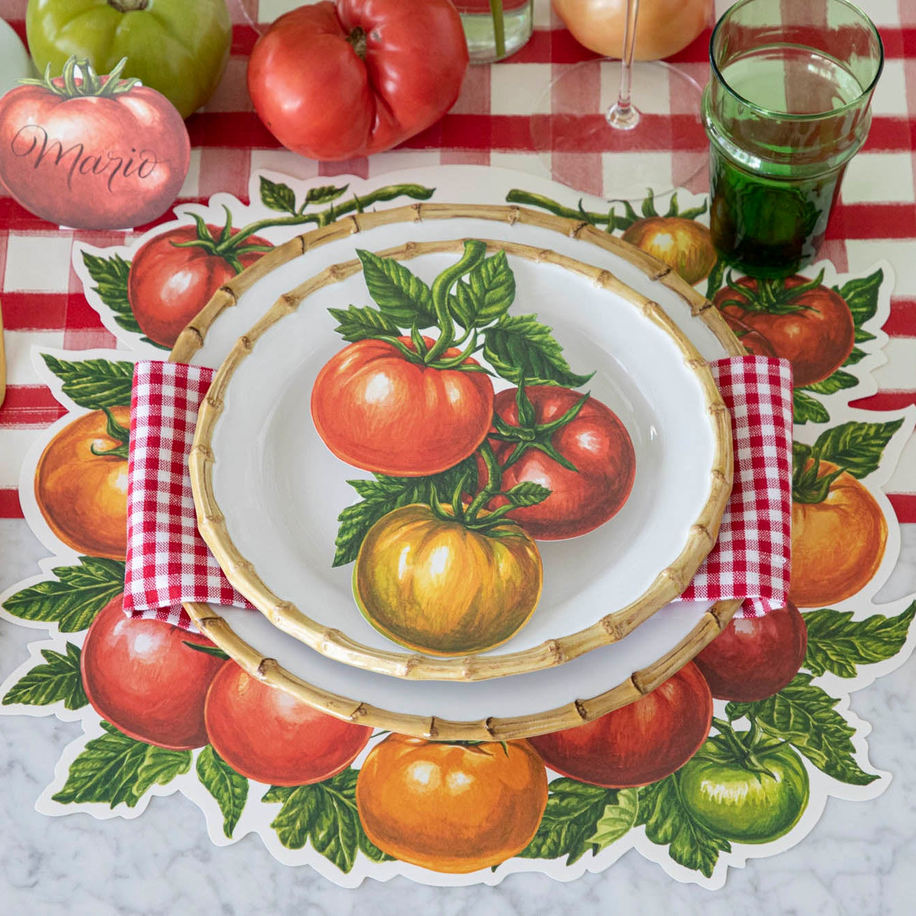 Die-cut Tomato Placemat on the Red Painted Check Runner, and tomato theme place setting on top.