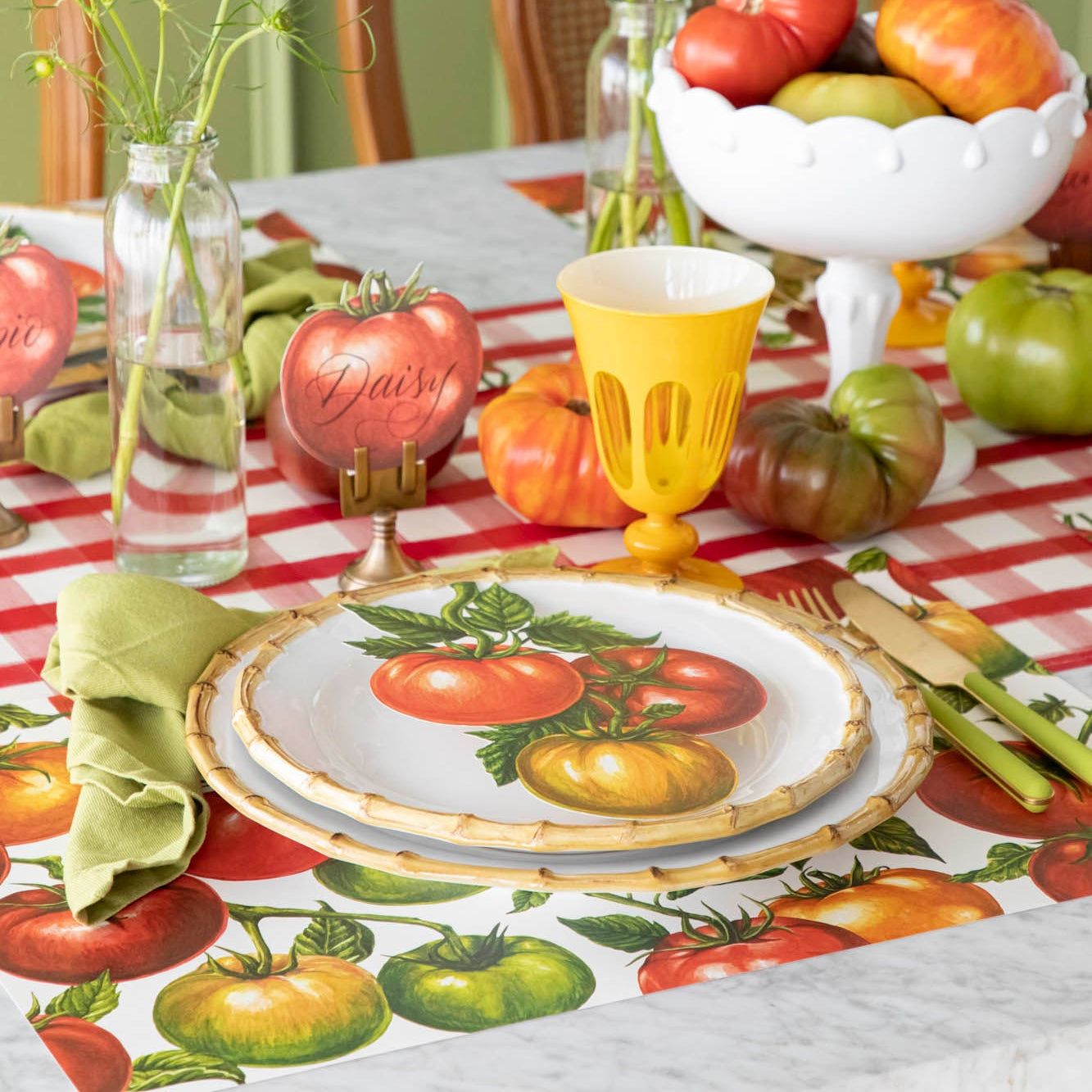 A summery, tomato themed table setting, with the Tomato Vine Placemat on the Red Painted Check Runner.