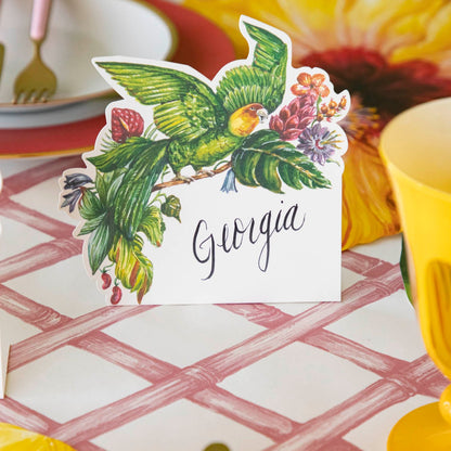 Parrot Place Card with &quot;Georgia&quot; written on it, behind a place setting.