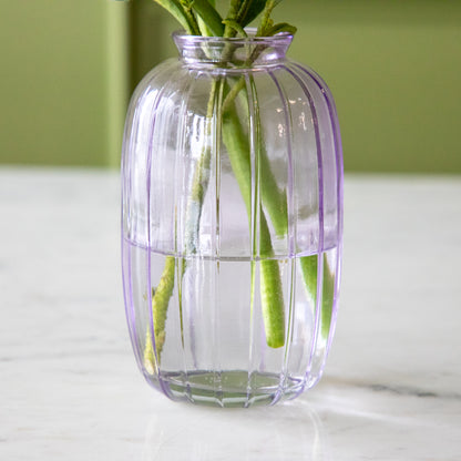 A close up of the Lilac Glass Bud Vase showing the ribbed design.