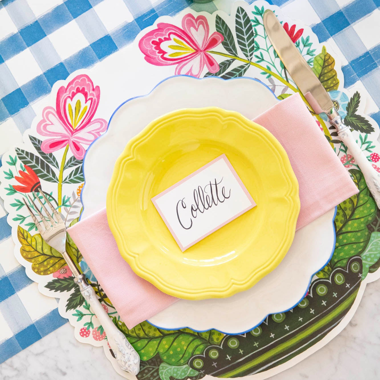 Die-cut Vase Arrangement Placemat under a floral themed place setting for one.