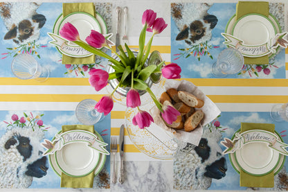 A spring table setting with an I Love Ewe Placemat centerpiece and tulips. (Brand Name: Hester &amp; Cook)