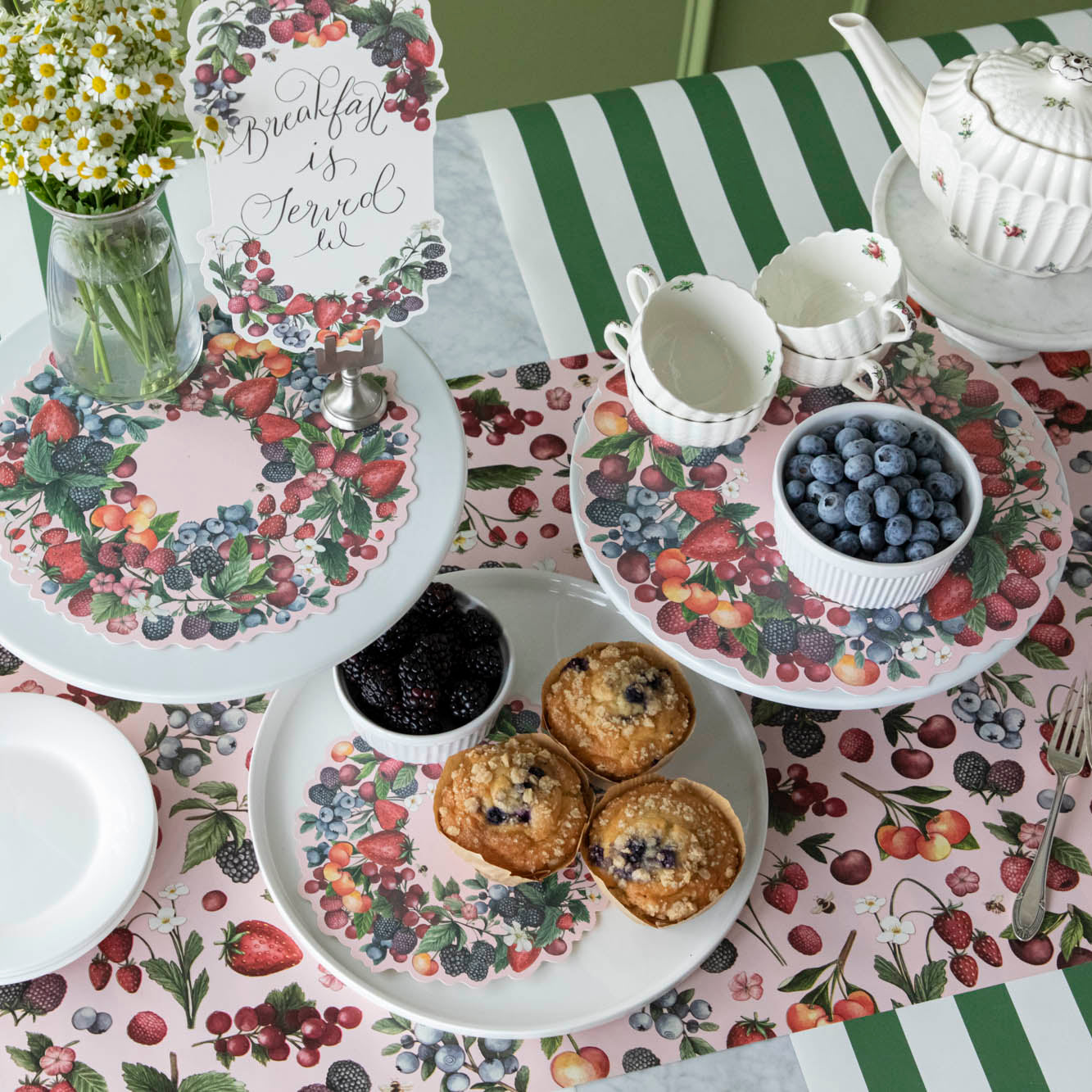 Wild Berry Serving Papers on serving stands, beneath berries and other hosting decor.