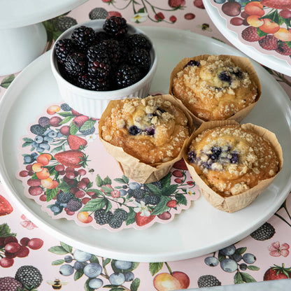 Wild Berry Serving Paper on a serving tray beneath a cup of blackberries and blueberry muffins.