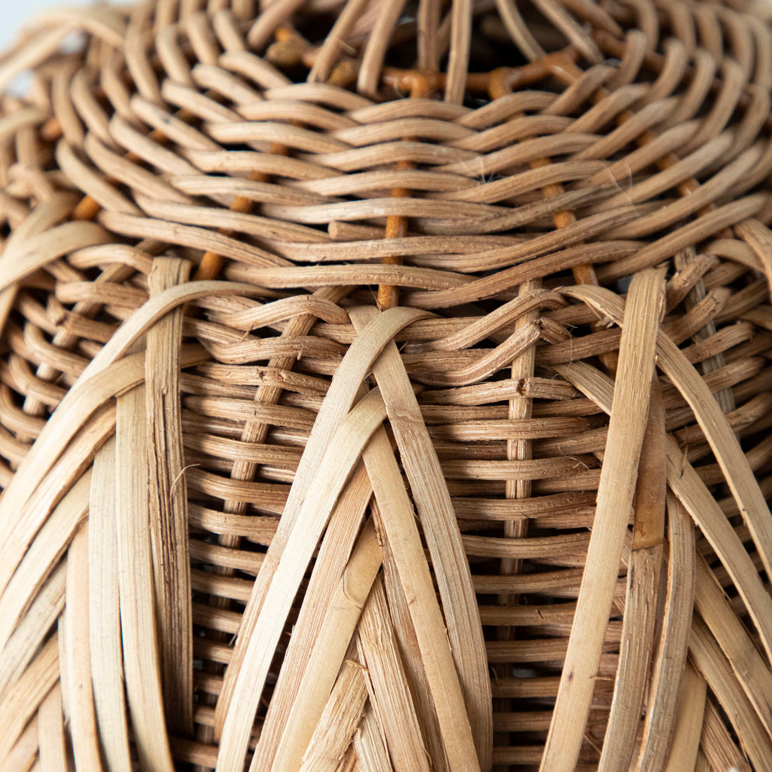 A close up of the wicker woven pumpkin.