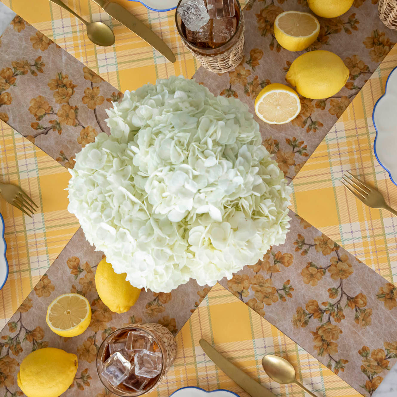 Marigold Cherry Blossom Runner under a bright and floral table setting.