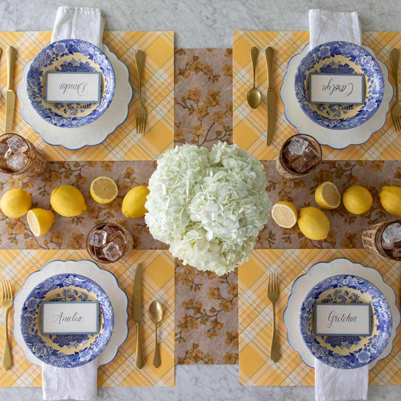 Marigold Cherry Blossom Runner under a bright and floral table setting for four.