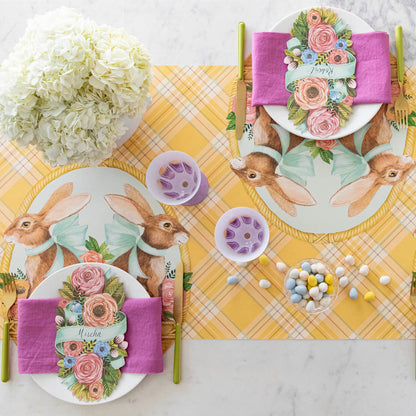 A Spring table setting for two with the Die-cut Bunny Basket Placemat on the Yellow Plaid Runner.