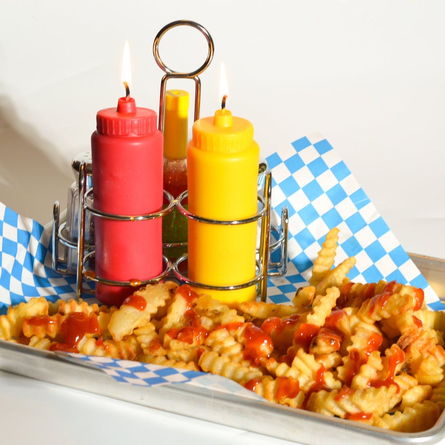 Ketchup and mustard candle set by Glow Worm Goods.