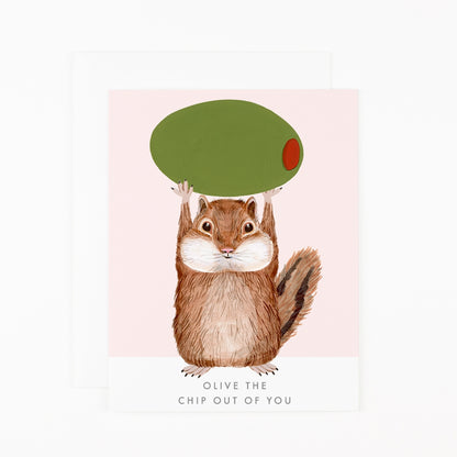 Greeting card by Dear Hancock with an illustration of a chipmunk holding up an olive with &quot;Olive the chip out of you&quot; printed on the bottom. 