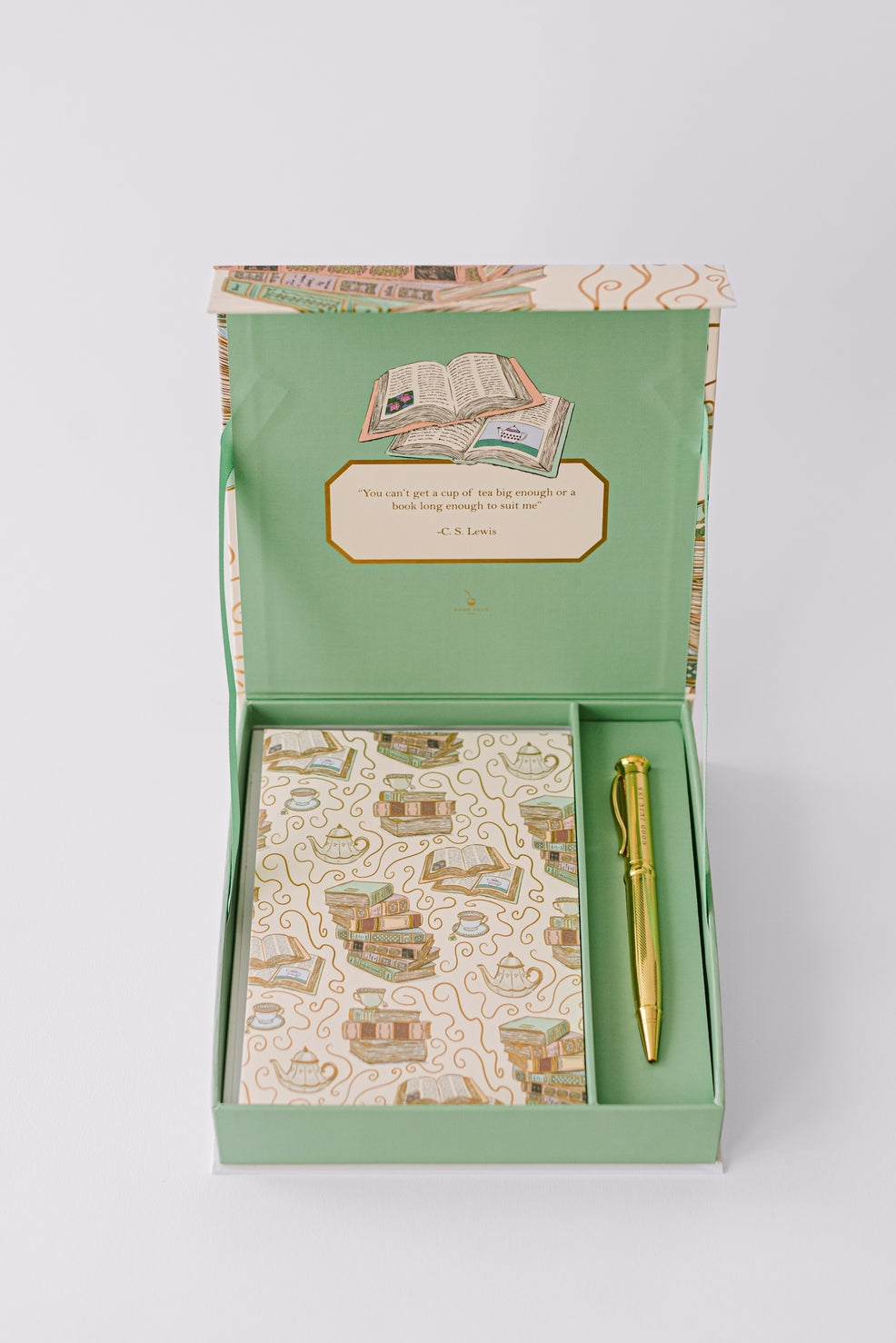 Cozy Book Stack Luxury Stationery Set inside of box with pen and notecard. 