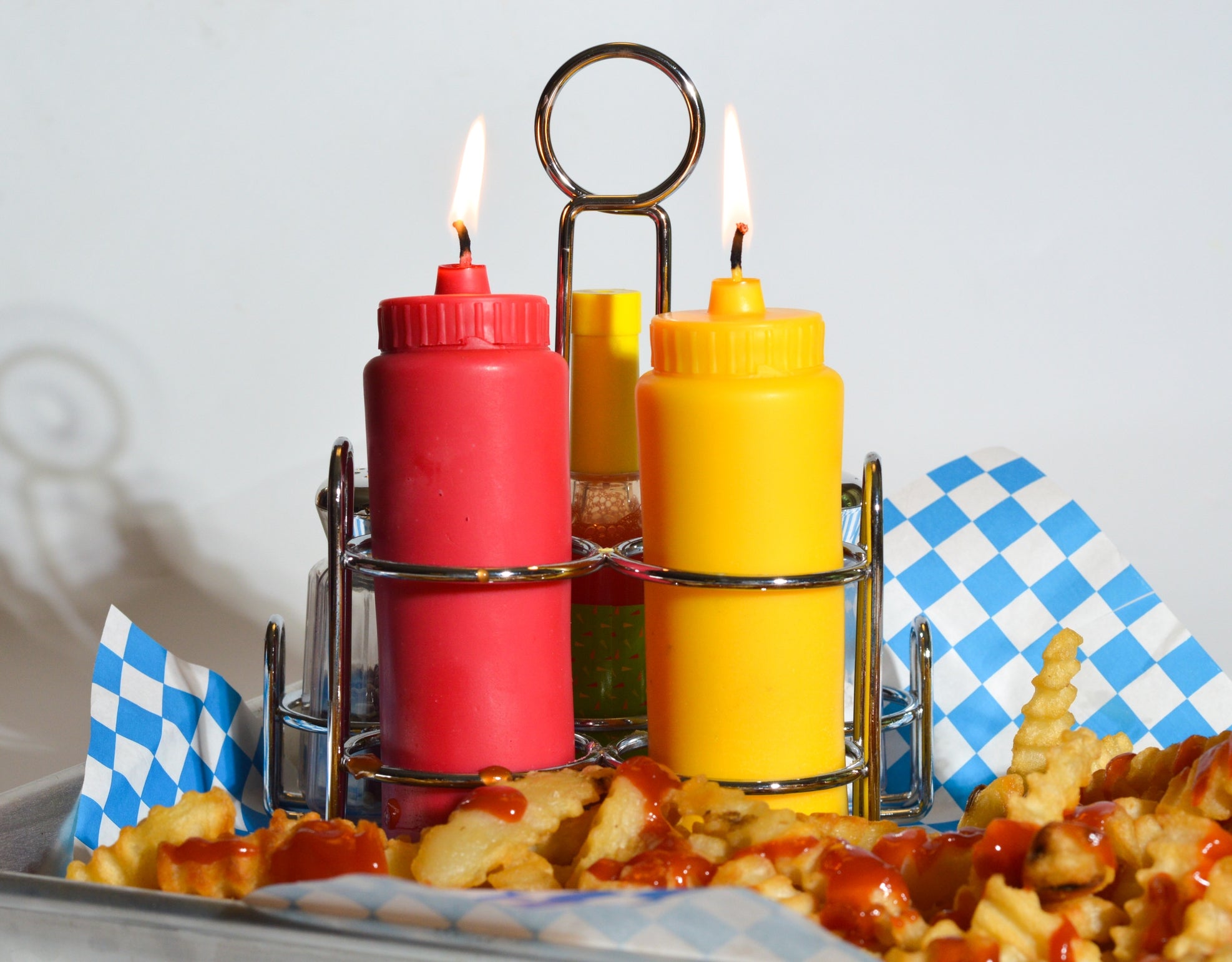 Ketchup and mustard candle set by Glow Worm Goods.