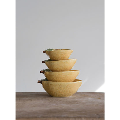 Stoneware Lemon Measuring Cups, Set of 4 stacked on top of each other showing the varying sizes.