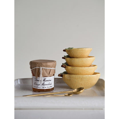 Stoneware Lemon Measuring Cups, Set of 4 stacked next to a jar of marmalade.