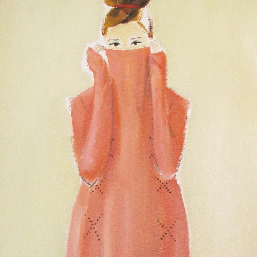 A framed painting of a stylish woman in a pink turtleneck with her hair up, portrayed on fine art paper using Epson Ultrachrome inks, displayed on a wall. Note: Peekaboo Small Art Print by Janet Hill.