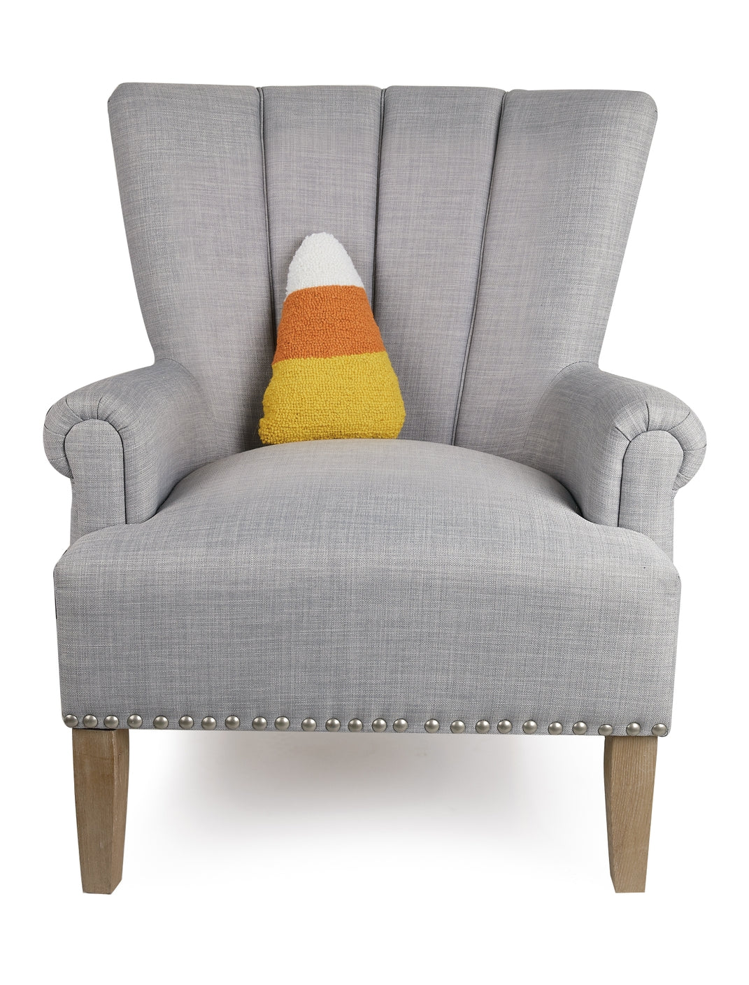 Candy Corn Shaped Hooked Pillow on chair