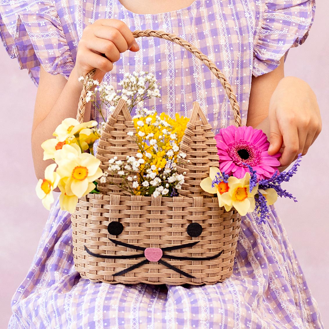 Recycled Paper Bunny Shaped Basket with flowers in it on a child&