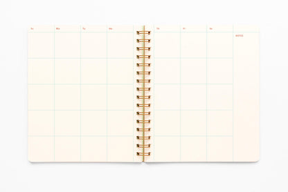 The inside of the Undated Letter Press Planner showing a blank monthly calendar across both pages.