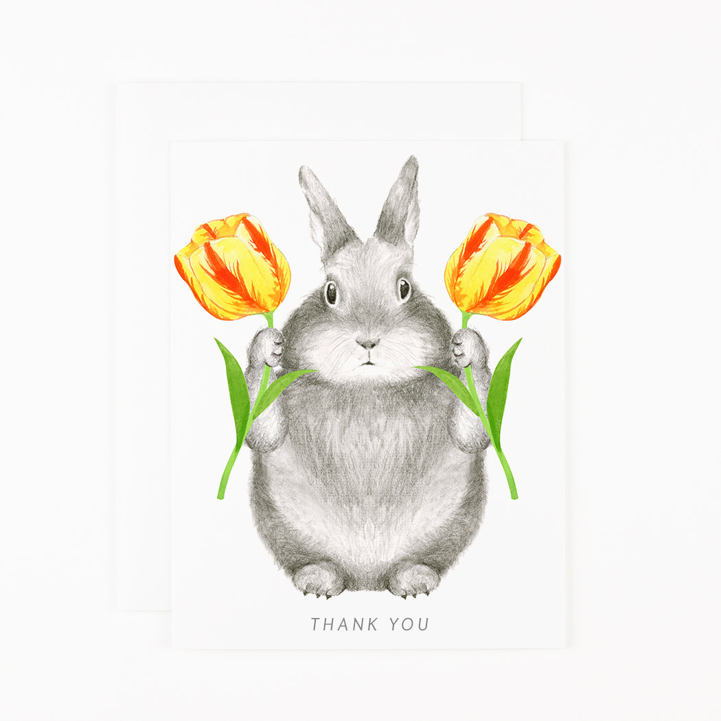 A Bunny with Tulips Card by Dear Hancock, featuring a bunny holding tulips, with a blank interior for your personal message.