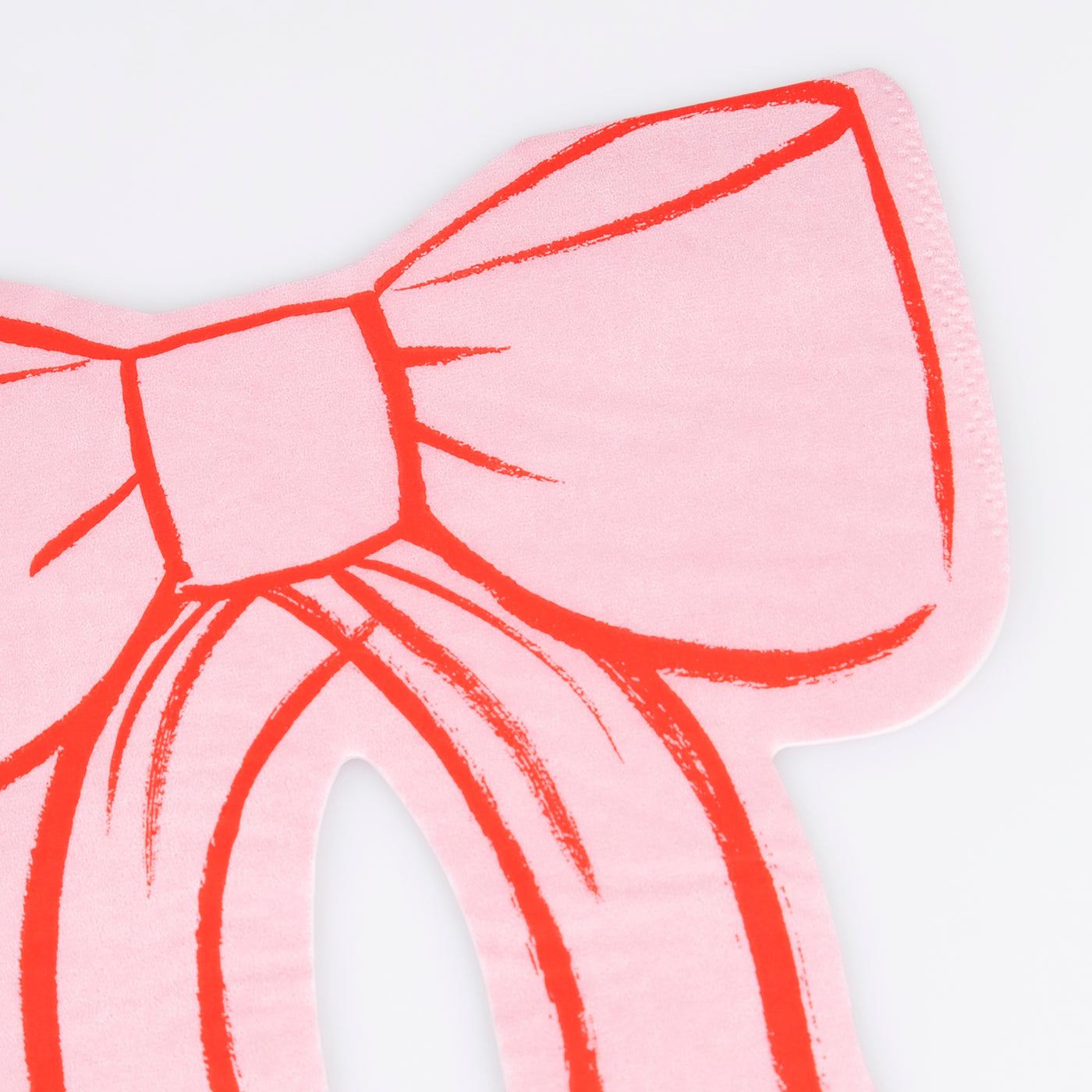 Pink bow shaped napkin with red outline by Meri Meri. 