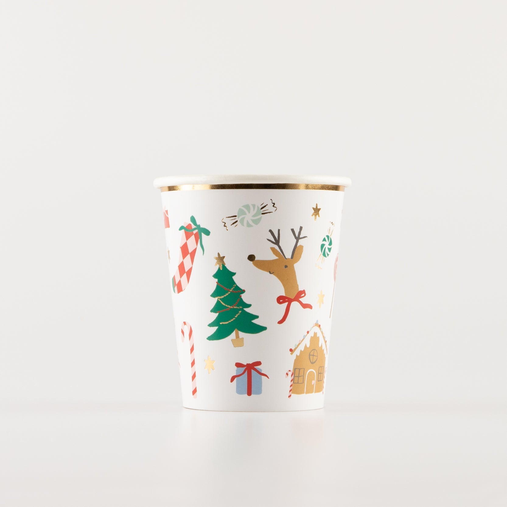 Jolly Christmas paper cup with various holiday ephemera printed on it