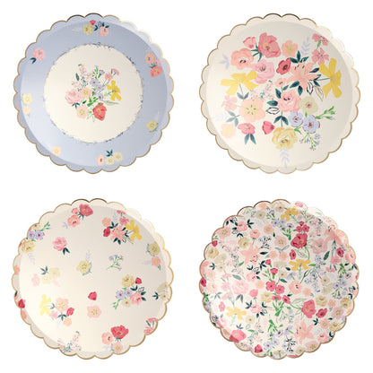 Four Meri Meri English Garden plates with floral designs on them.