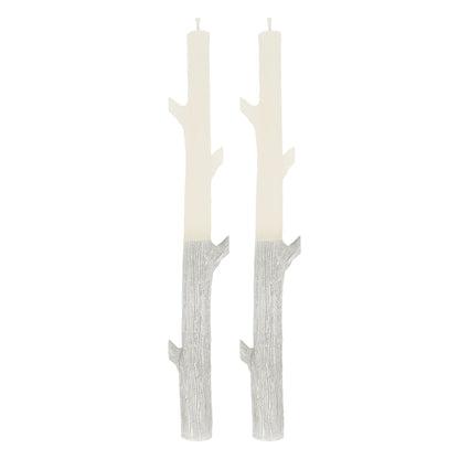 Pair of a white textured candles shaped like a stick with silver on bottom portion.