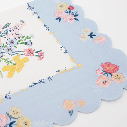 A set of Meri Meri English Garden Napkins with floral designs, perfect for a party table.