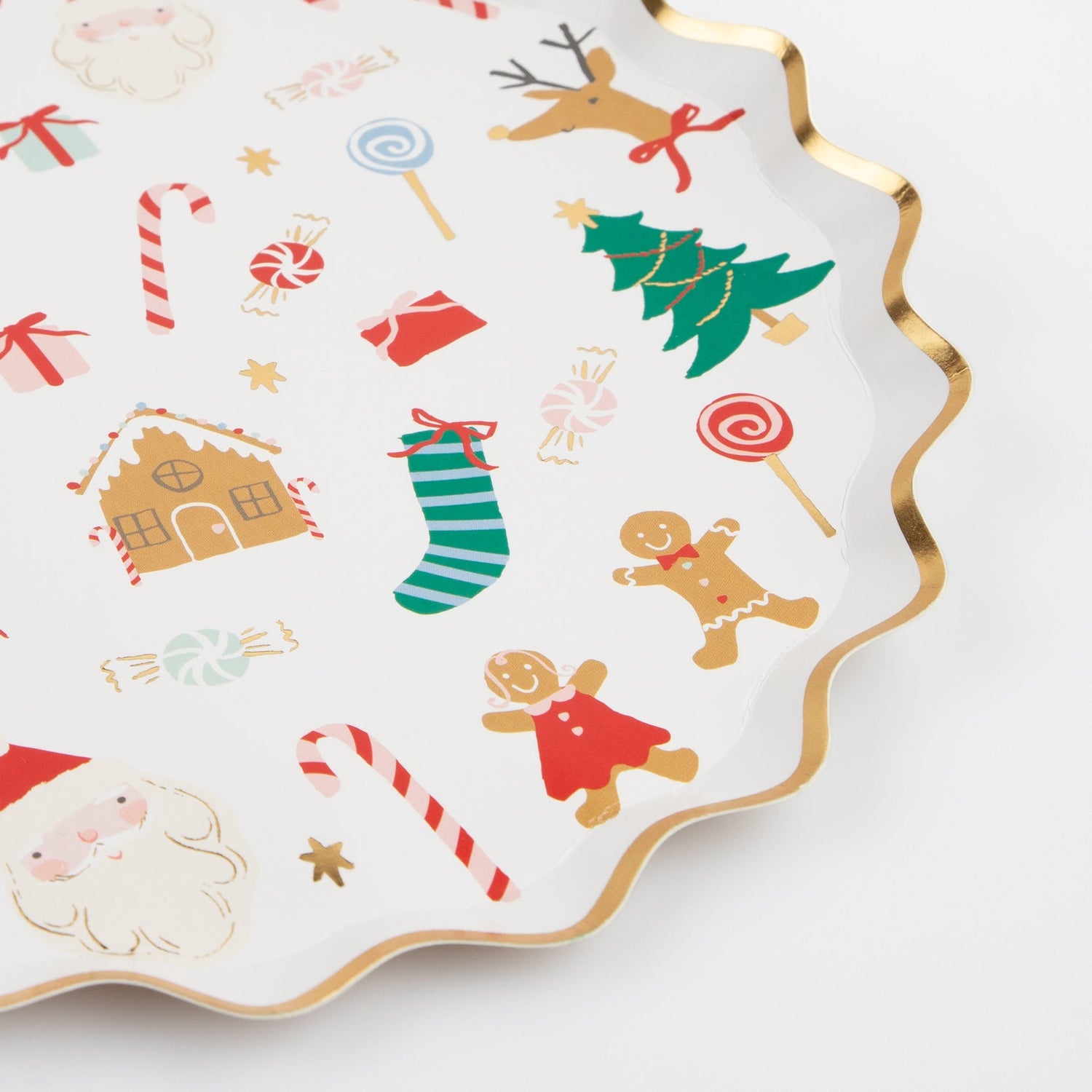 Close up of Jolly Christmas Plate showing gold foiled scalloped edge and Christmas icons.