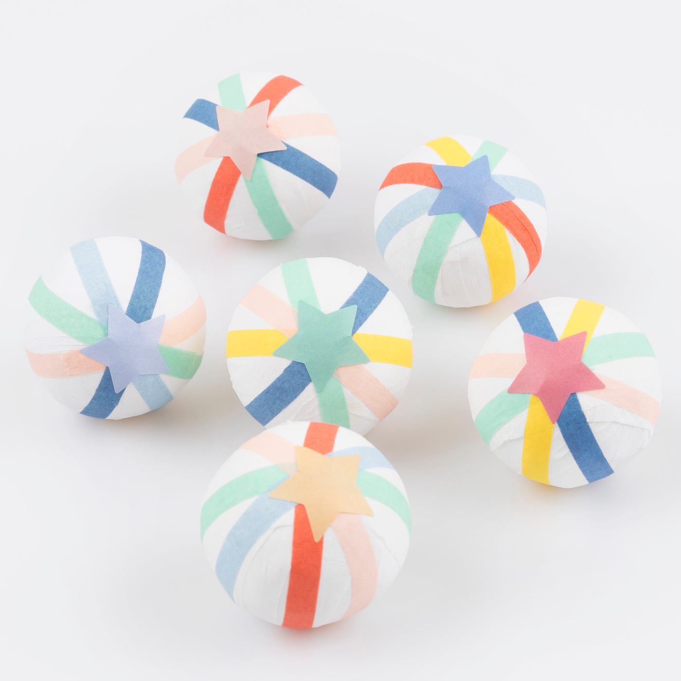 Crepe paper balls in green, pale blue, blue, yellow, coral, peach pink and white
Star stickers on the top and bottom of each ball. 