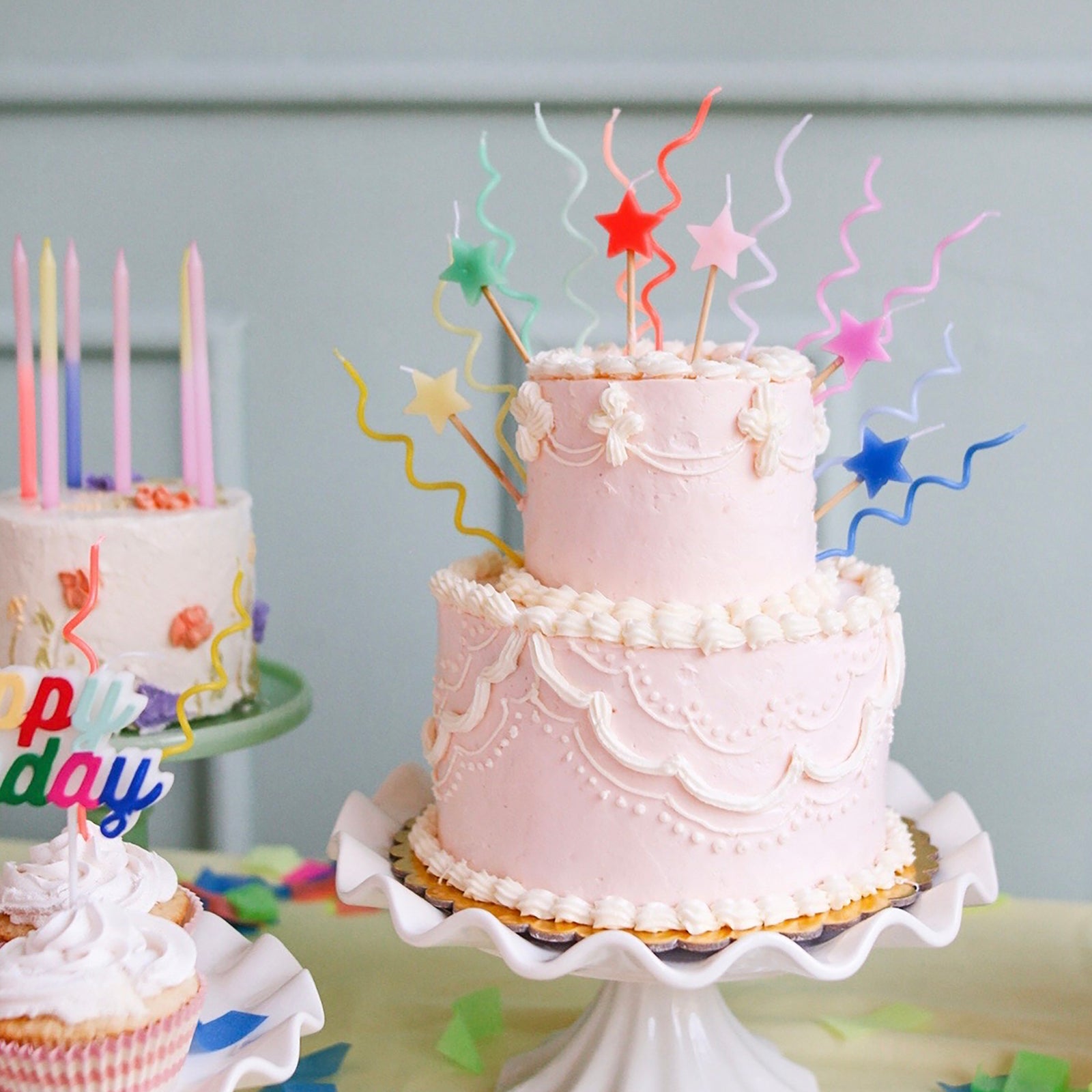 Birthday cake with Mixed Star Candles atop it. 