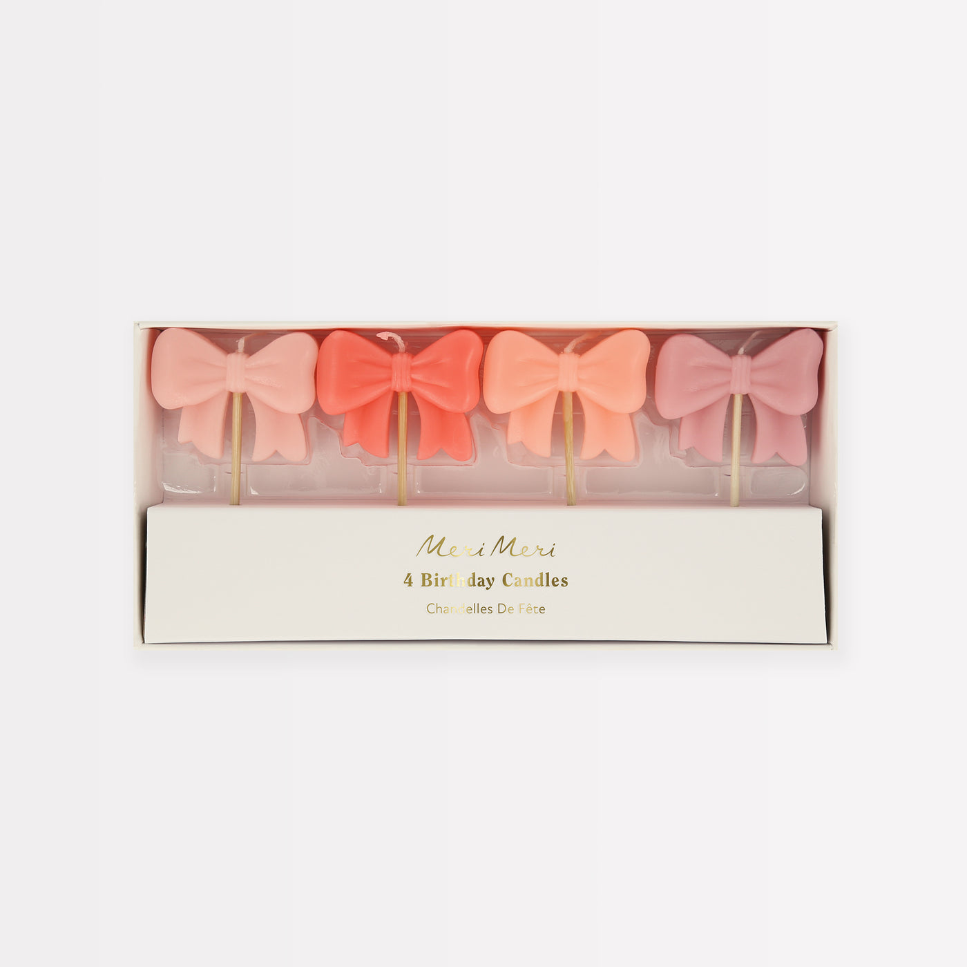 Four 3D Bow candles in shades of pink.