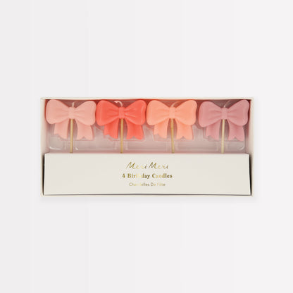 Four 3D Bow candles in shades of pink.