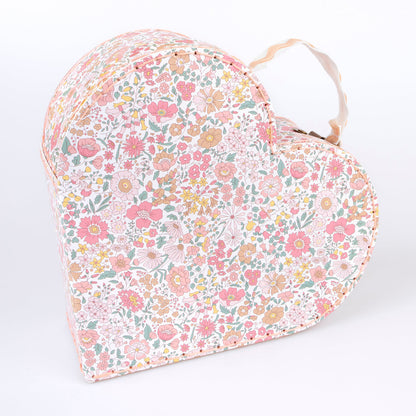 Two different sized heart-shaped suitcases made from stitched card with lamination. The smaller case can be stored inside the larger.  Each suitcase features a different Liberty floral print design, with pink tones, on the outside.