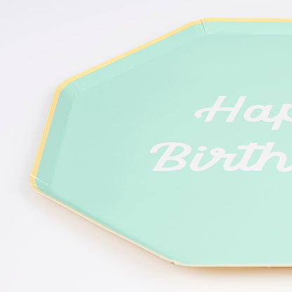 Octagonal shaped paper plate in mint saying &quot;Happy Birthday!&quot;. 