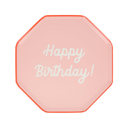 Octagonal shaped paper plate in pink saying &quot;Happy Birthday!&quot;. 