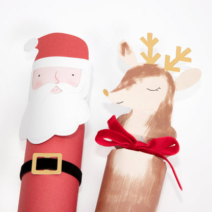 A close up of the Christmas Character Characters of a happy Santa and smiling reindeer with a velvet bow around its neck.