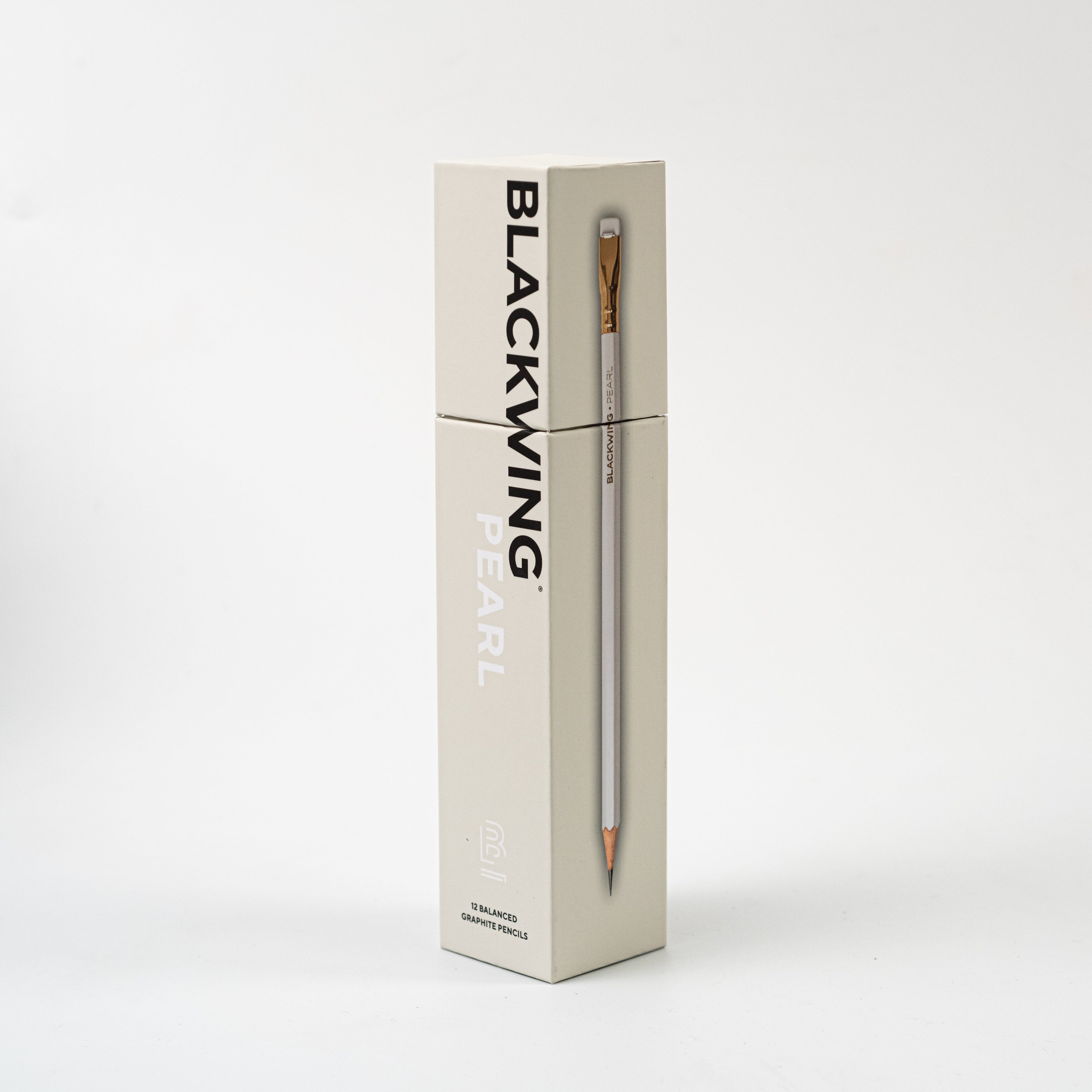 A Blackwing Pearl Pencils Set of 12 with a graphite core and white eraser next to its packaging box on a white background.