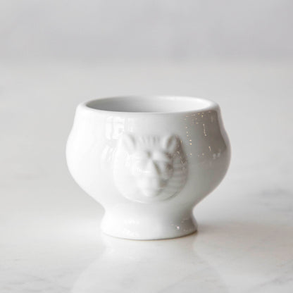 Three White Porcelain Mini Bowls with assorted spices and a spoon on a marble surface by BIA.