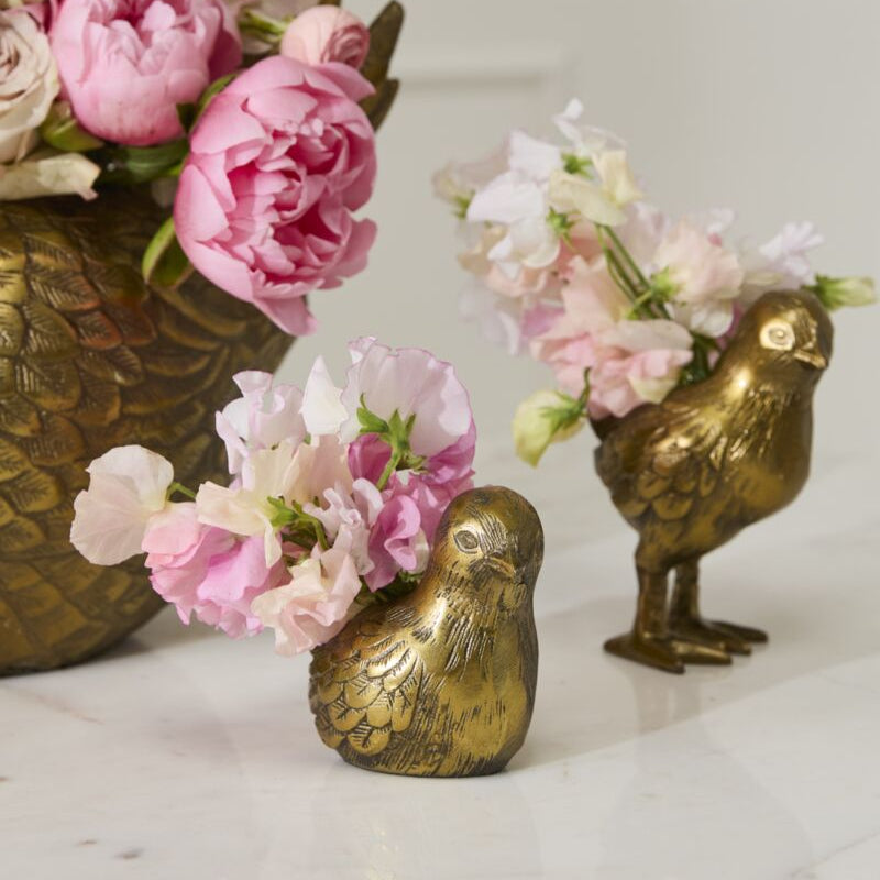 Spring Roost Budvases with spring flowers coming out their backs.